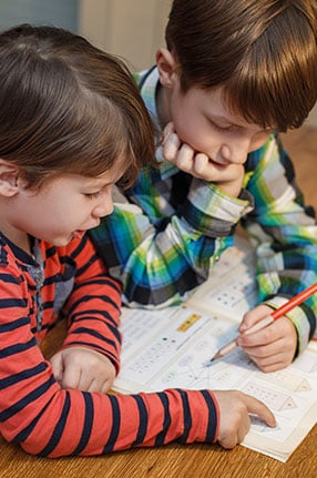 two boys learning together