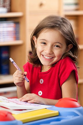 female student colouring